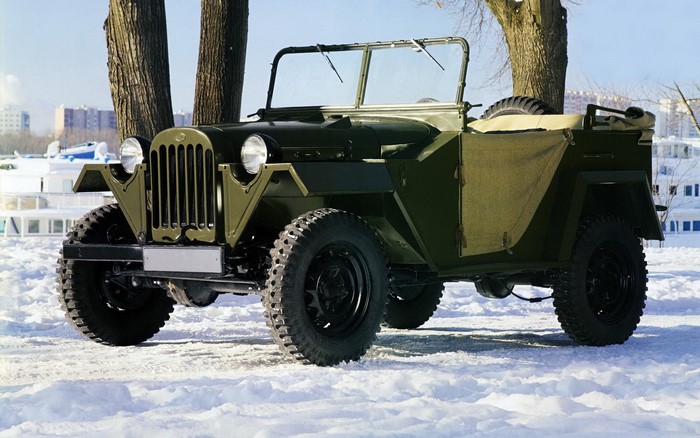Green retro Russian off-road vehicle in snow