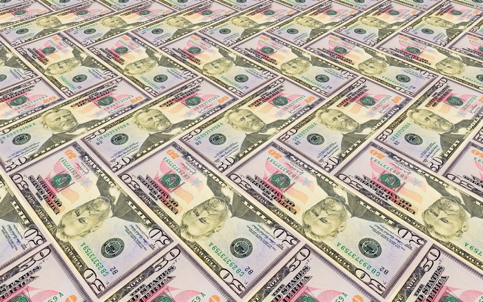 A large pile of US fifty-dollar bills