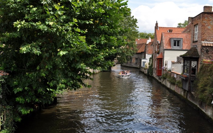 Boat tour on a canal in Bruges, Belgium