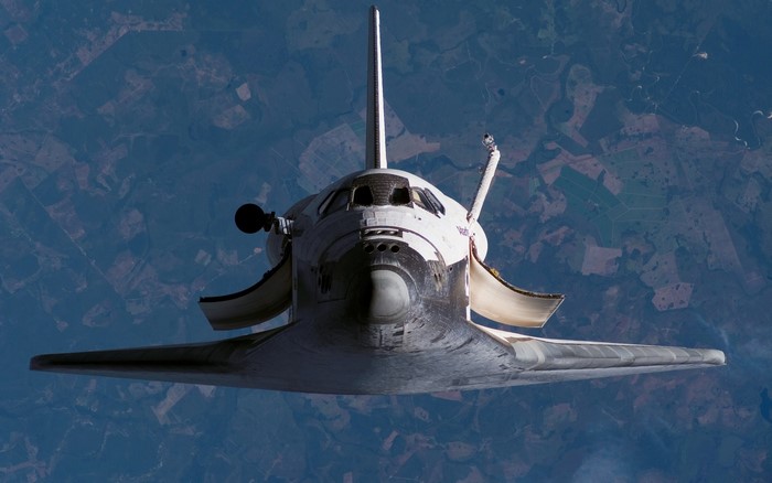 Space Shuttle Atlantis in orbit above Earth