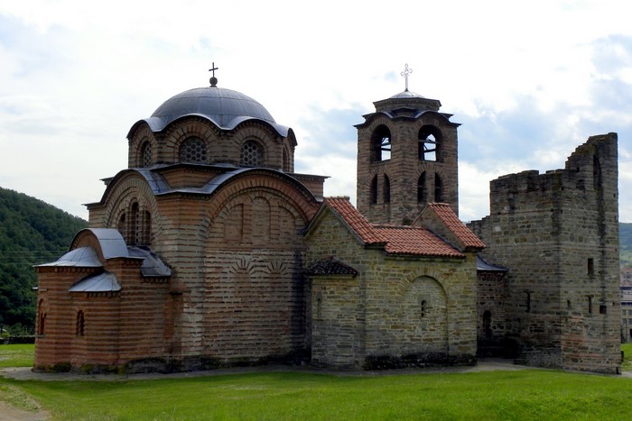 Church and bell tower with stone ruins