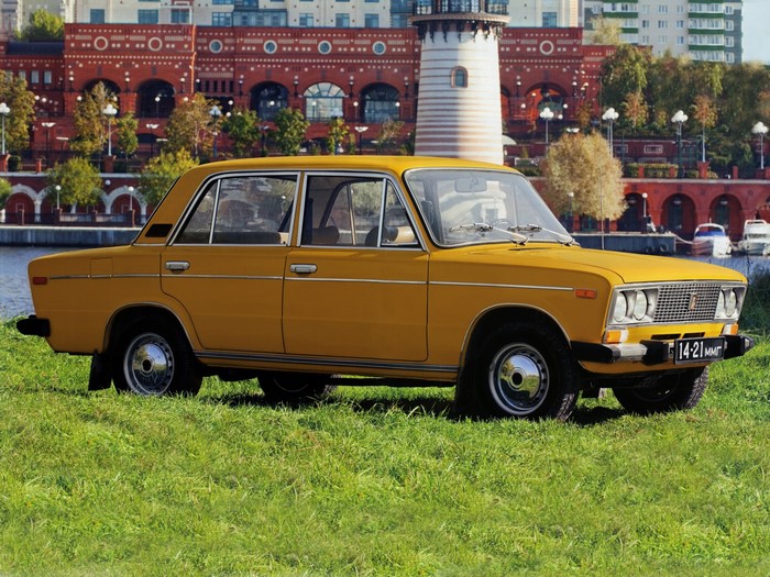 Yellow VAZ-2106 car parked on grass