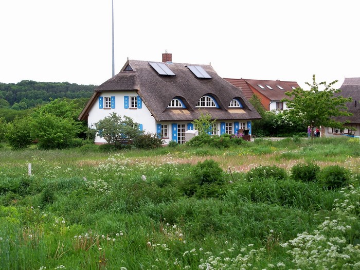 Thatched roof houses in Germany with solar panels