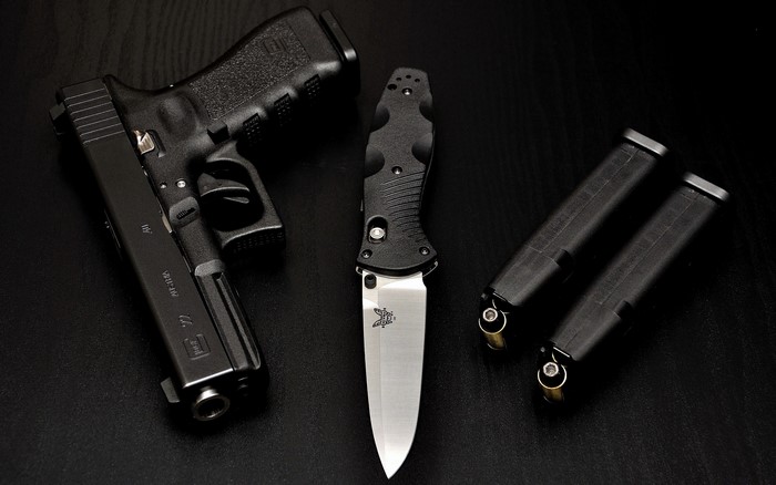 Glock pistol, folding knife, and magazines