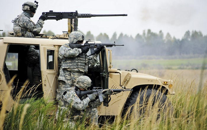 Soldiers in a Humvee with machine gun