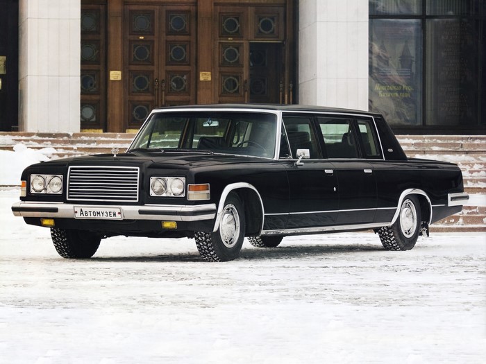 Black Zil limousine parked in front of a building