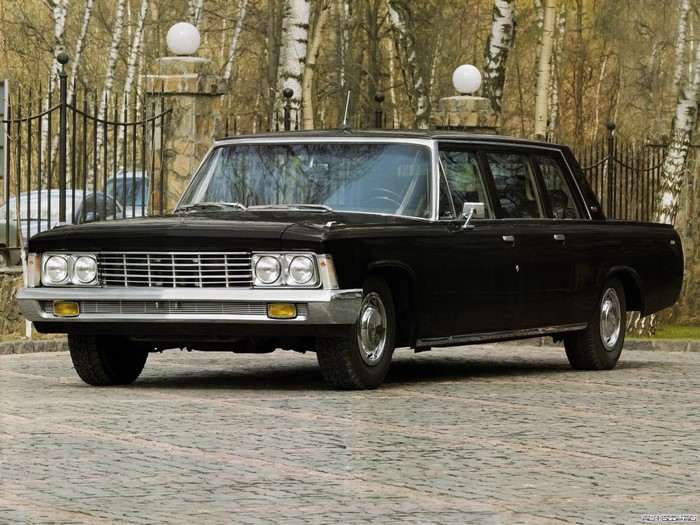 Black GAZ-13 Chaika limousine parked on cobblestone