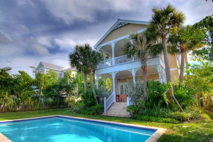 Tropical resort with swimming pool and palm trees