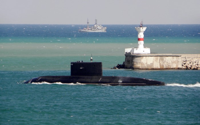 Submarine and Lighthouse at Sea