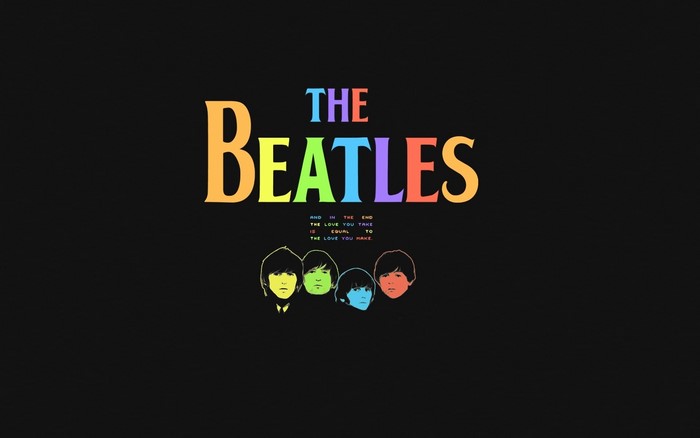 The Beatles logo with band members' silhouettes
