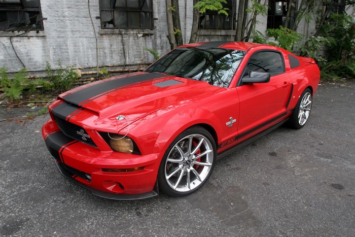 Red Shelby Ford Mustang GT500 with black stripes