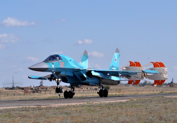 Sukhoi Su-34 fighter jet landing with drag parachute