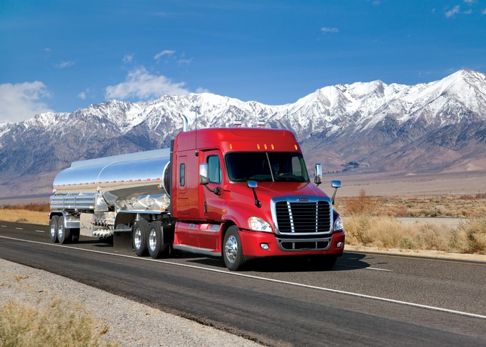Red Freightliner Tanker Truck on a Highway