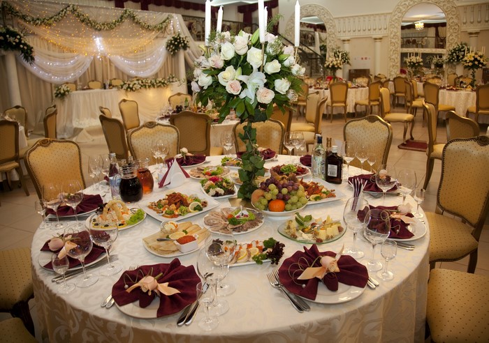 Wedding reception interior with decorated tables