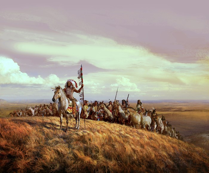 Native American tribe on horseback on a hill