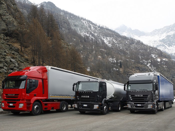 Three Iveco trucks on a mountain road