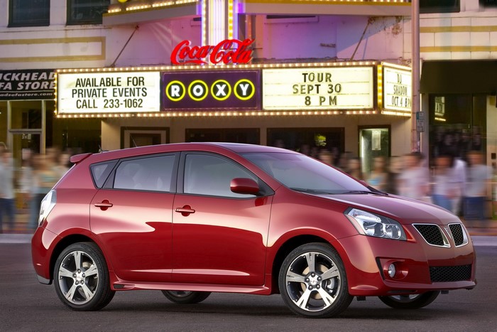 Red Pontiac Vibe in front of Roxy Theater