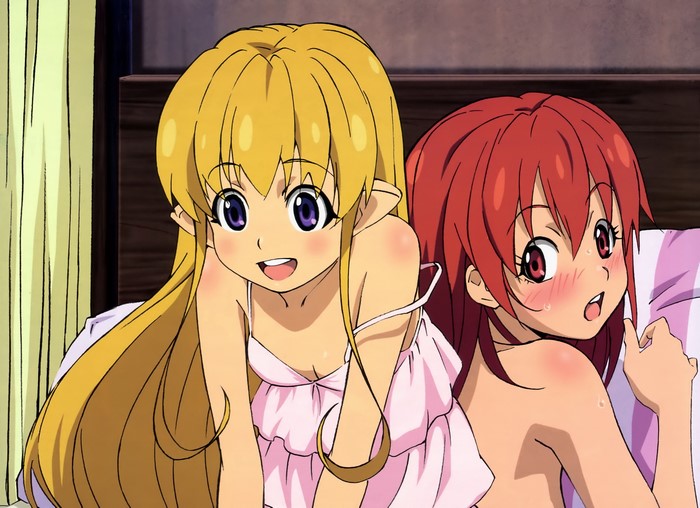 Two young women in bed