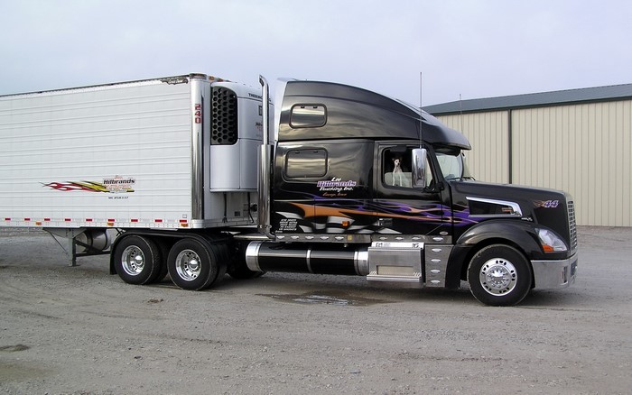 Black Volvo Truck with Hillbrands Trailer