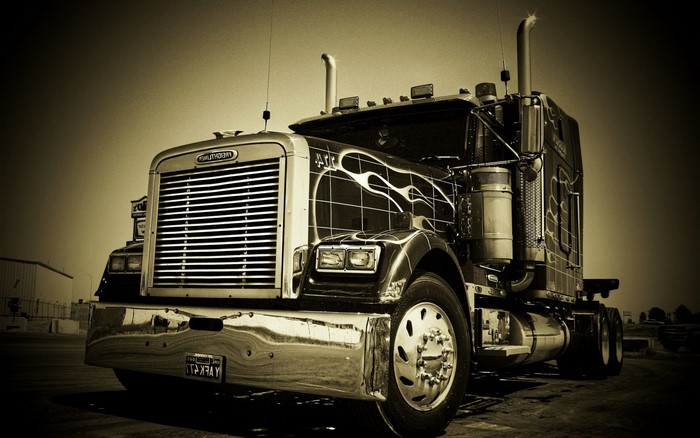 Freightliner semi-truck with flame decals