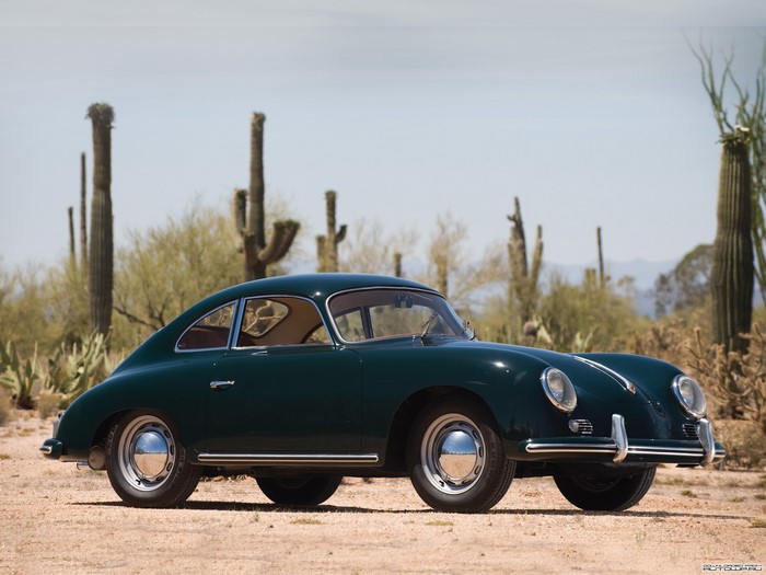 Green Porsche 356 coupe in desert landscape