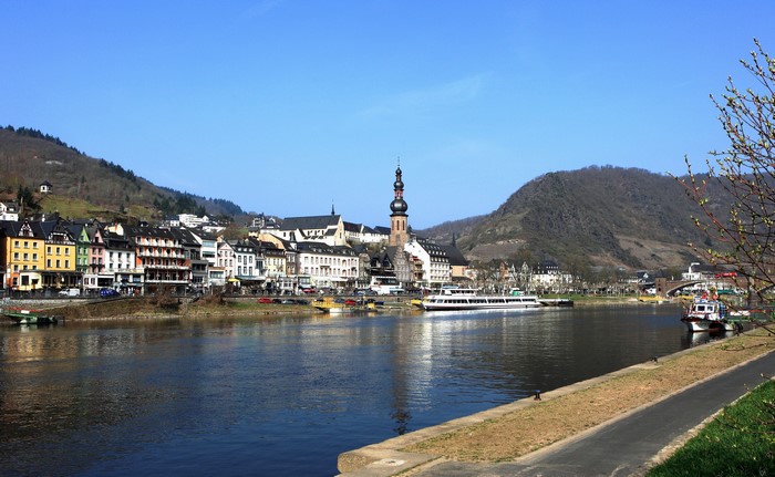 Cochem, Germany riverside town with boats and church tower