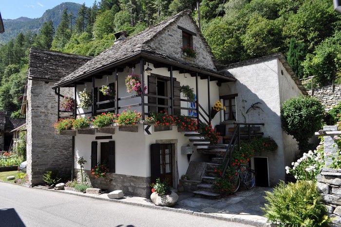 Stone houses with flowers in Ticino, Switzerland