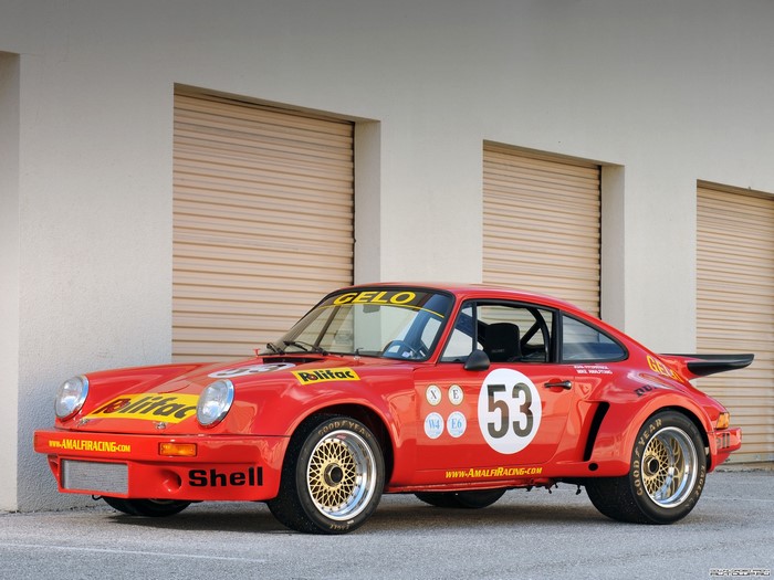 Red Porsche 911 race car with number 53