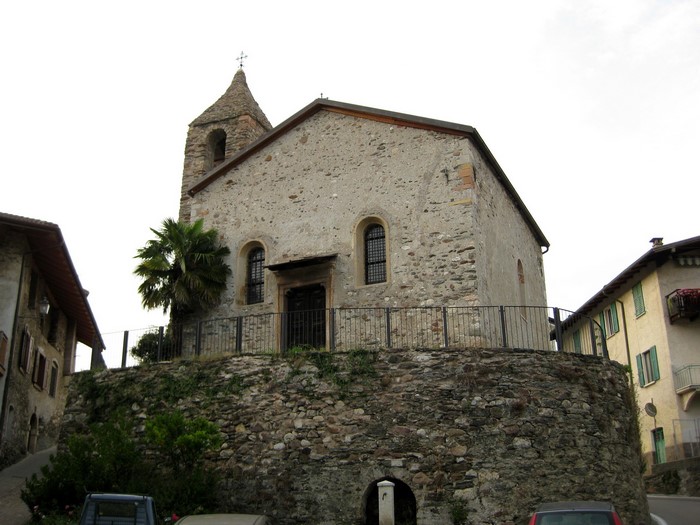 Stone church with bell tower in Italian village