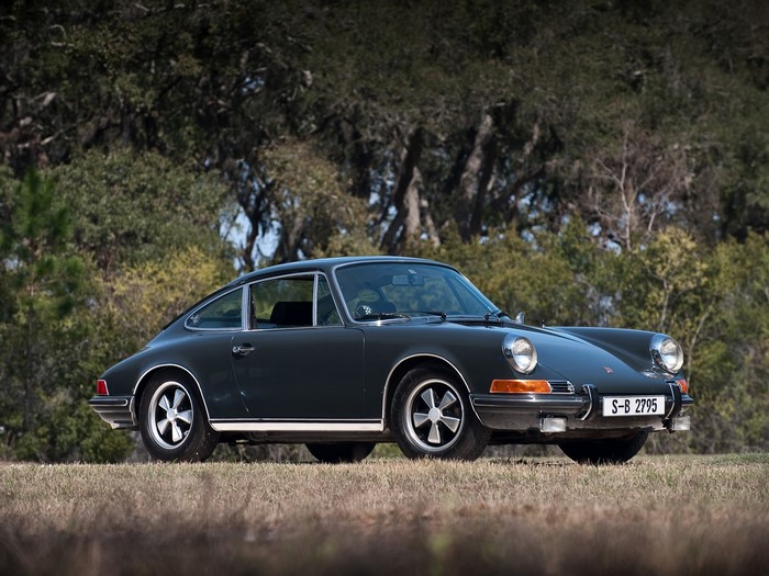 Dark Green Porsche 911 parked on grass
