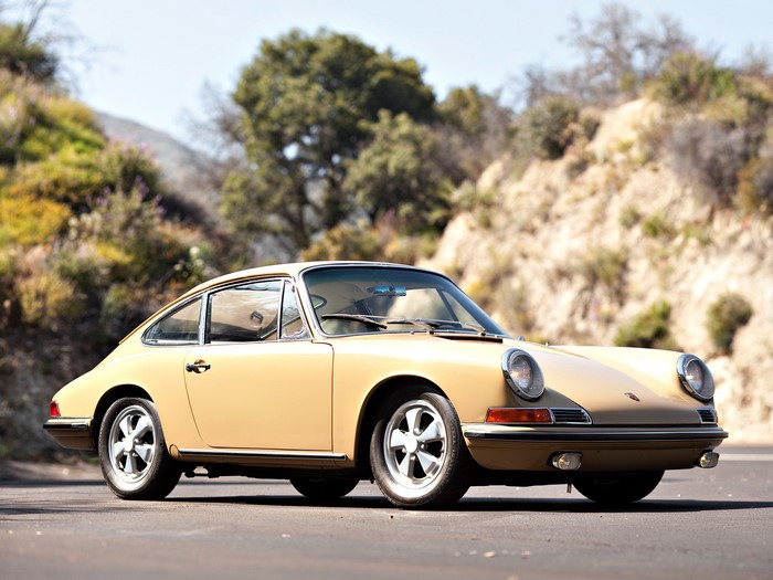 Tan Porsche 911 parked on a road