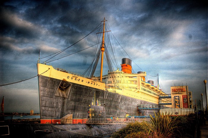 The Queen Mary ship docked with a submarine