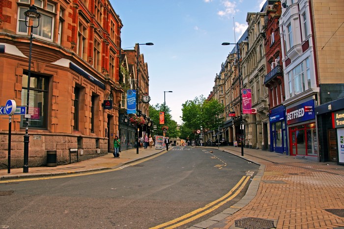 Street scene in the United Kingdom with shops and buildings
