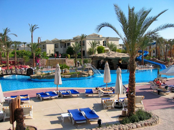 Resort pool with palm trees and water slides in Sharm El Sheikh, Egypt