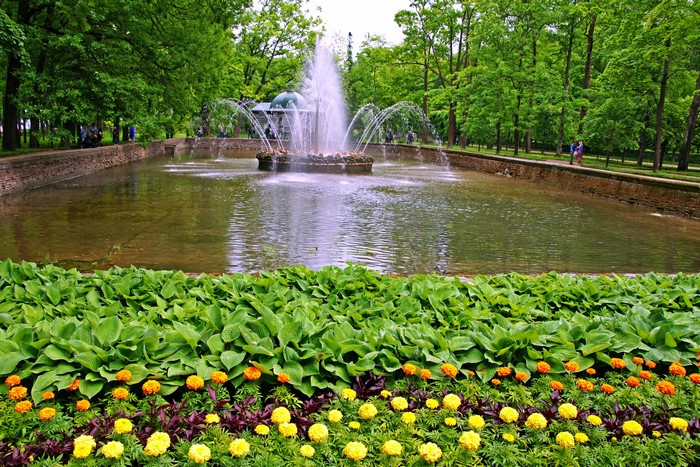 Fountain in a park with flowers