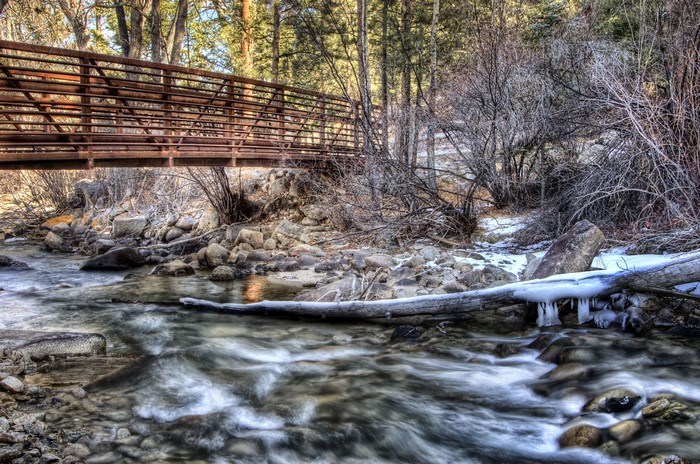 Bridge over a rocky river in winter