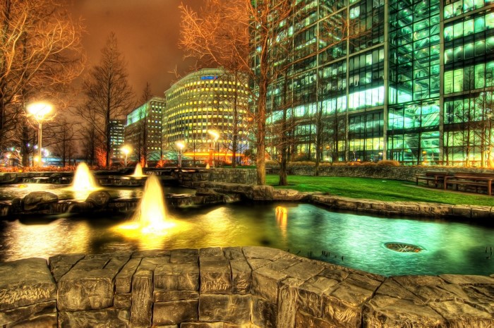 Fountains and modern buildings at night
