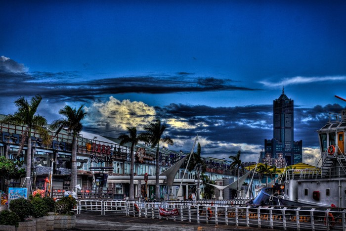 Harbor with Tall Building and Palm Trees