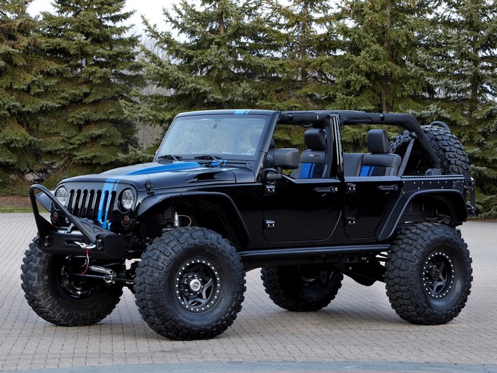 Black Jeep Wrangler with blue stripes and large tires