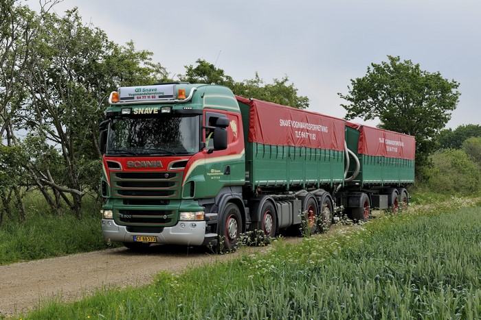 Scania truck with trailers on a dirt road