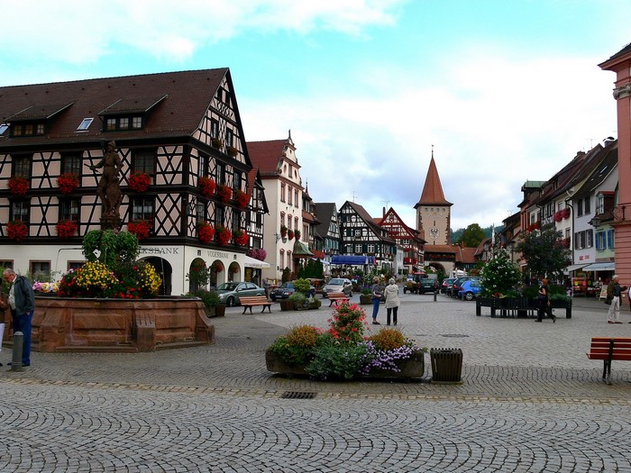 Town square with fountain and half-timbered houses in Germany