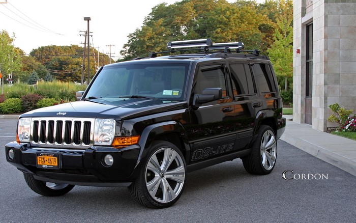 Black Jeep Commander with custom rims