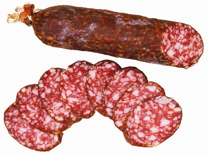 Whole and sliced salami sausage