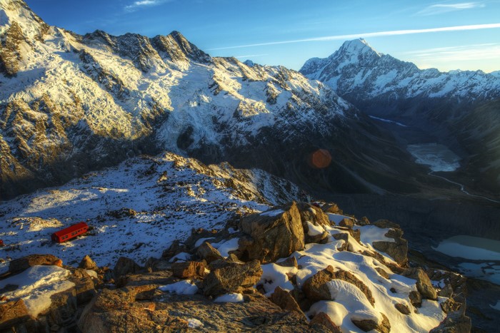 Snowy Mountains with Red Hut and Glacier Lake