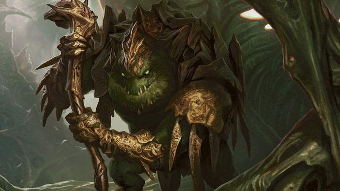 Green monster with golden armor holding a staff