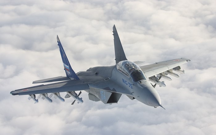 Mikoyan MiG-35 Fighter Jet Flying Above Clouds