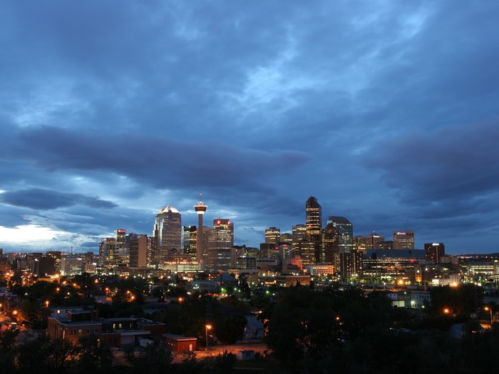 Calgary skyline at dusk with dramatic clouds