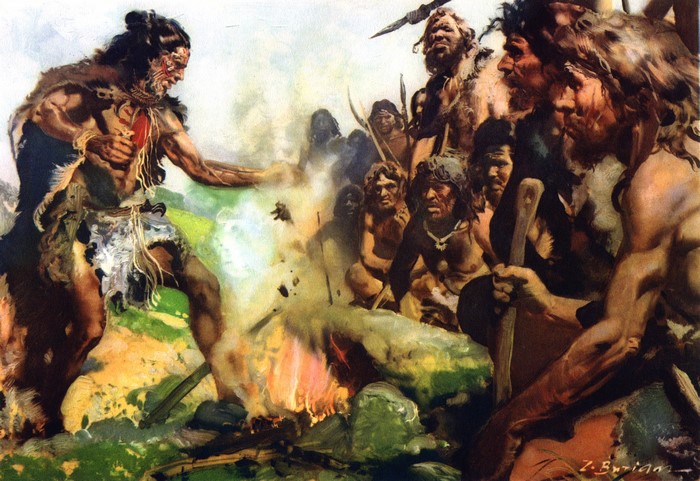 Prehistoric people gathered around a fire