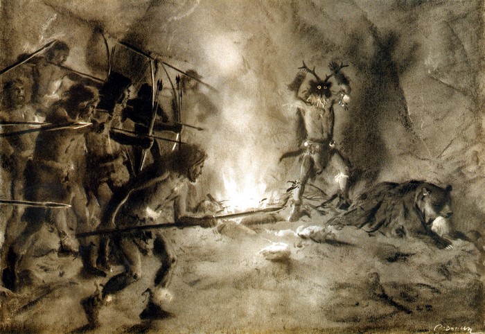 Cave painting of prehistoric hunters and a shaman with a bear