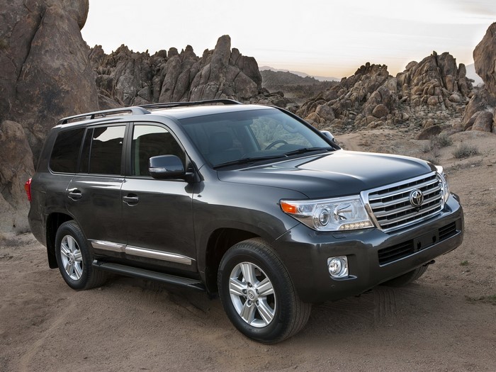 Dark gray Toyota Land Cruiser parked on dirt road